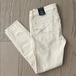 American Eagle Outfitters Cream Distressed Skinny Jeans